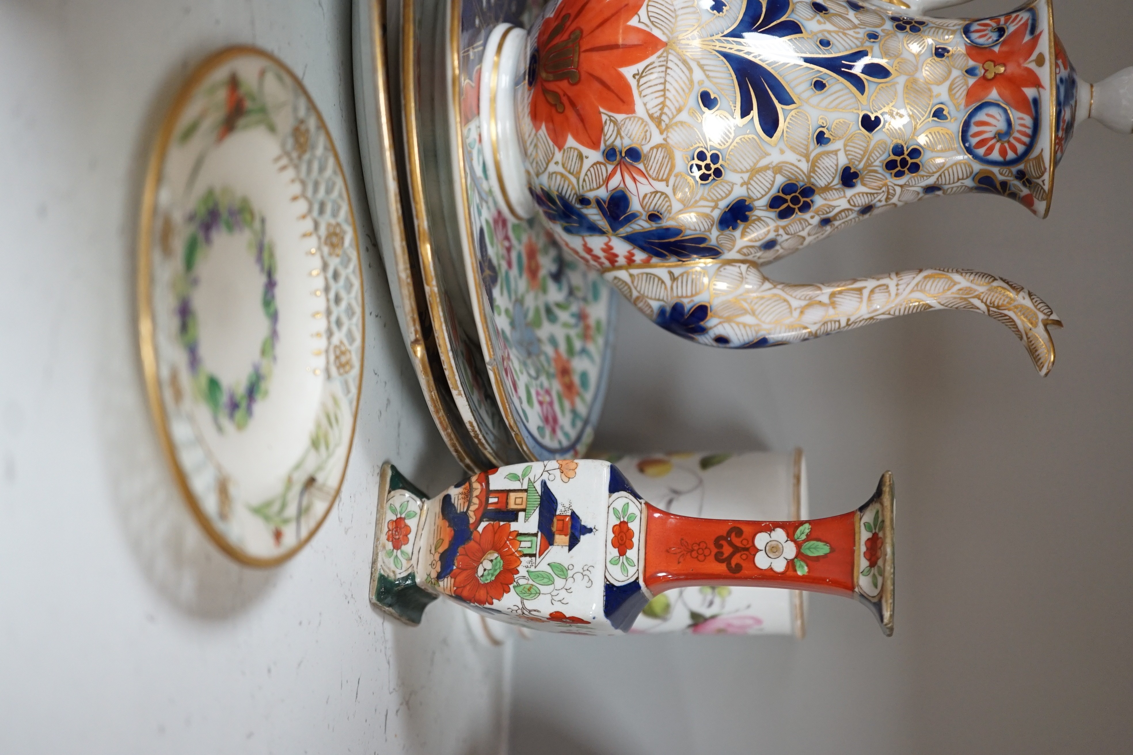 A selection of English porcelain and ceramics, to include a two handled Wedgwood Queensware urn, cover and stand, c.1800, two 19th century Worcester pierced bordered dishes, etc.